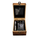 open wooden box featuring a glass with engraved highland cow, whisky stones, ice picker and a slate coaster. - Image