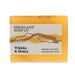 A rectangular bar of Highland Soap Co. Whisky & Honey handmade soap, featuring a warm amber-yellow color with visible honeycomb texture and embedded natural elements. - Image