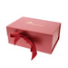 Red gift box with a red ribbon and 'Hirundine' branding on a white background - Image