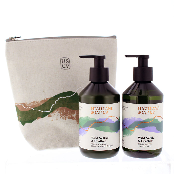 Two bottles of Highland Soap Co. Wild Nettle & Heather products with a pouch on a white background - Image