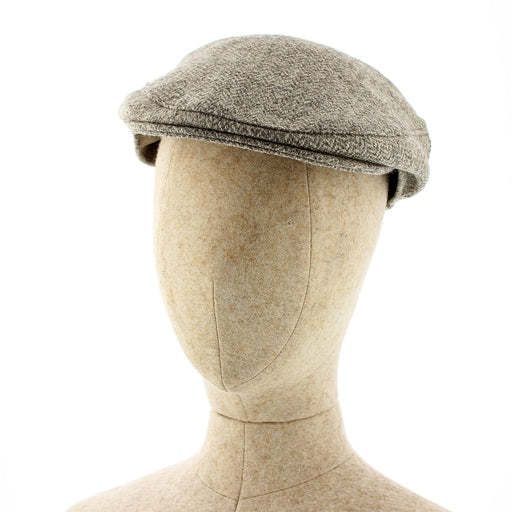 Gray flat cap on a mannequin head against a white background - Image