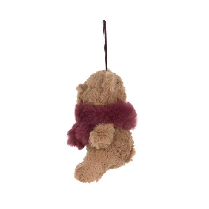 A plush teddy bear decoration in tan with a burgundy faux-fur scarf and a dark hanging loop, shown against a plain white background. - Image
