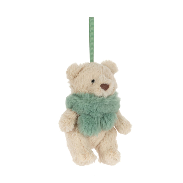A small plush teddy bear decoration in cream-colored faux fur, wearing a fuzzy mint green scarf and hanging from a matching green ribbon loop, shown against a plain white background. - Image