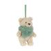 A small plush teddy bear decoration in cream-colored faux fur, wearing a fuzzy mint green scarf and hanging from a matching green ribbon loop, shown against a plain white background. - Image