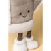 Close up of a plush soft toy in the shape of a winter mitten with wooly feet against a beige backdrop. - Image