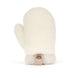 Plush soft toy in the shape of a cream-colored fleece mitten with a ribbed knit cuff and a small brown brand tag, shown against a plain white background. - Image