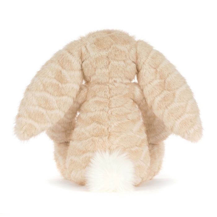 A plush bunny toy photographed from the back on a clean white background. The bunny has long floppy ears, a textured beige faux-fur body, and a fluffy white tail. - Image