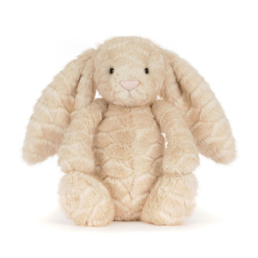 A plush stuffed bunny toy in a soft cream-beige color with long floppy ears, black bead eyes, and a small pink stitched nose, photographed on a clean white background. - Image