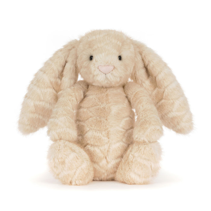 A plush stuffed bunny toy in a soft cream-beige color with long floppy ears, black bead eyes, and a small pink stitched nose, photographed on a clean white background. - Image