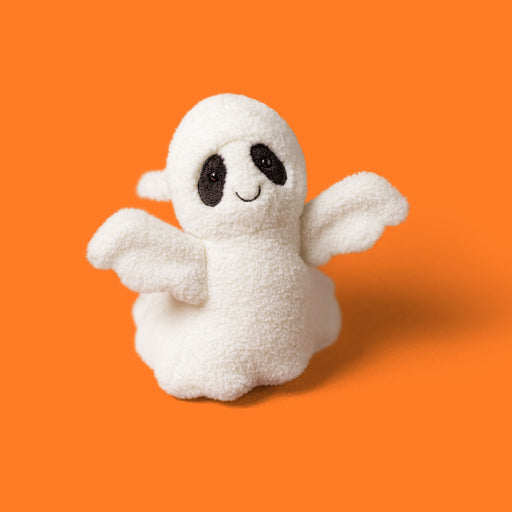 plush ghost soft toy with smiley face and black eyes against an orange background - Image