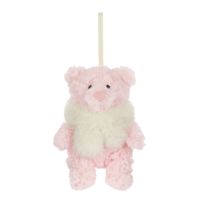 A small plush teddy bear hanging decoration in soft pink and cream white, with a cream hanging ribbon at the top, shown against a plain white background. - Image