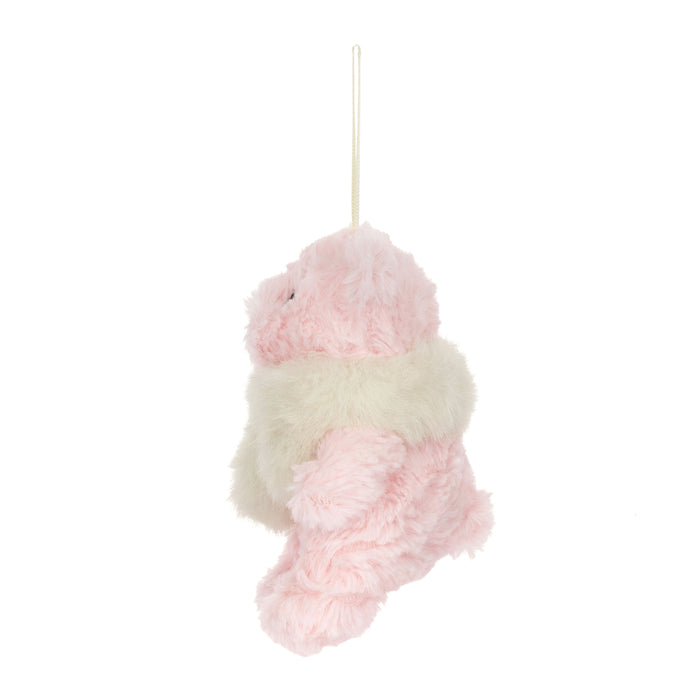 A fluffy teddy bear decoration shown against a plain white background. The ornament is light pink with a cream fluffy scarf and matching hanging ribbon.  - Image