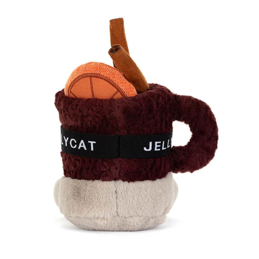 A plush soft toy in the shape of a mug with festive toppings and ski mask.  - Image