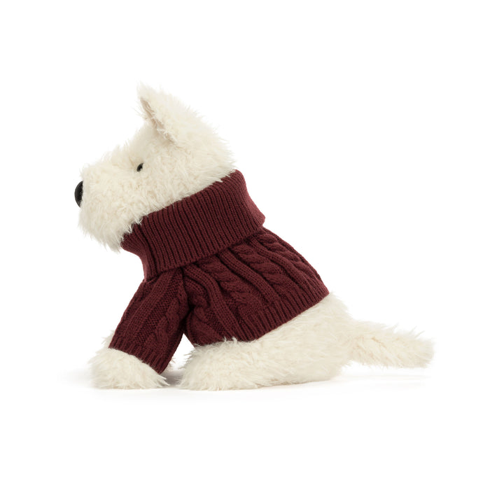 A plush dog toy wearing a burgundy cable-knit turtleneck sweater, photographed on a clean white background. - Image