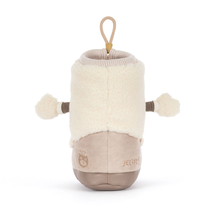 Back of a plush soft toy snow boot against a white backdrop - Image