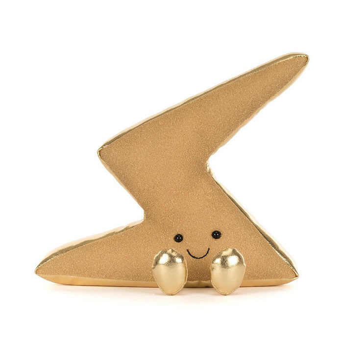 A gold glittery lightning bolt plush toy with a cute embroidered face and small gold bead feet, set against a plain white background. - Image