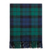 A folded plaid scarf with fringe at the bottom, featuring a tartan pattern in green, blue, and black on a white background. - Image