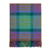 Plaid tartan throw in green and purples folded on a white background.  - Image