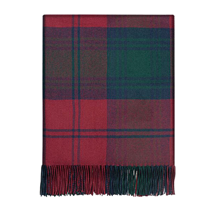 A folded plaid throw blanket with fringed edges, featuring blocks of red, dark green, and navy blue in a tartan pattern, shown against a plain white background. - Image