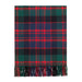 A classic tartan plaid throw blanket with fringed edges, featuring a pattern of green, navy blue, black, and red stripes, shown flat against a plain white background. - Image