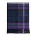 A folded tartan plaid scarf in purple, navy, and black with thin green and white stripes, finished with fringed ends, shown on a plain white background. - Image