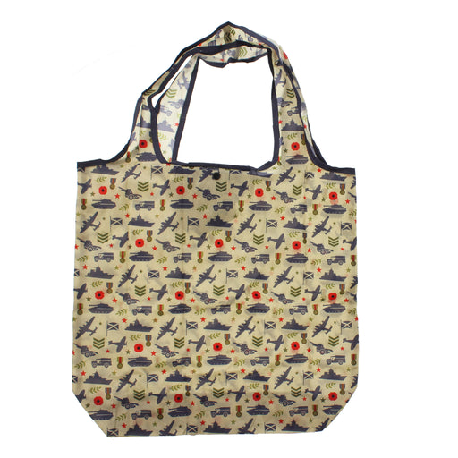 A reusable tote bag with a beige background and an all-over military-themed pattern featuring navy blue silhouettes of aircraft, ships, tanks, and soldiers, accented with small red circles and olive green details. The bag has dark navy blue trim and handles. - Image
