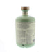 Back label on a mint green bottle of liqueur against a white background.  - Image