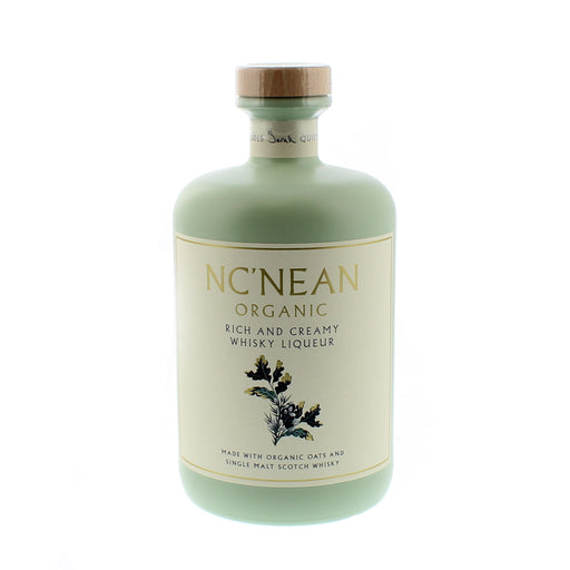 Mint green bottle of NcNean Whisky Liqueur against a white backdrop - Image