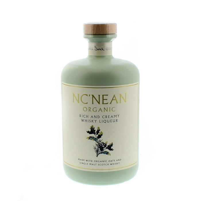 Mint green bottle of NcNean Whisky Liqueur against a white backdrop - Image