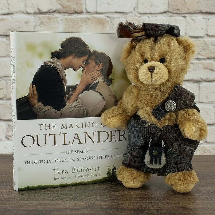 Book titled 'The Making of Outlander' with a teddy bear in a costume on a white background - Image