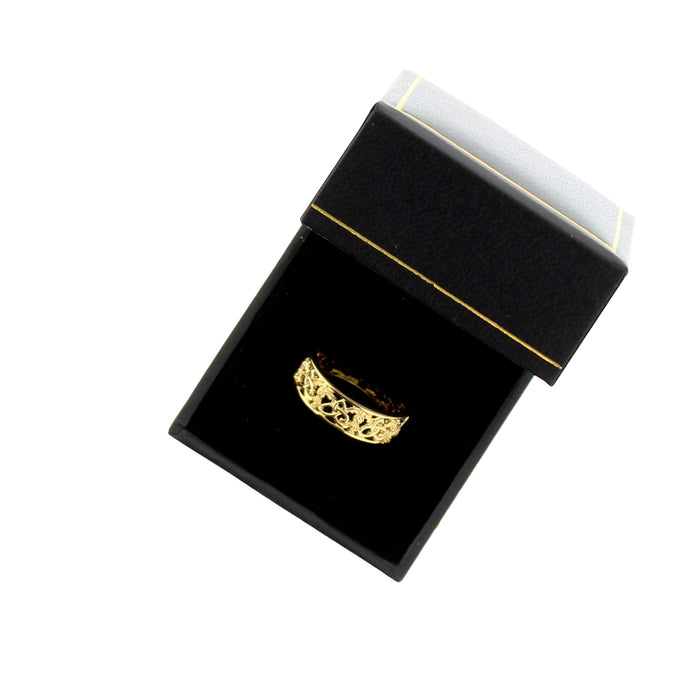 Gold ring in a black box on a white background - Image