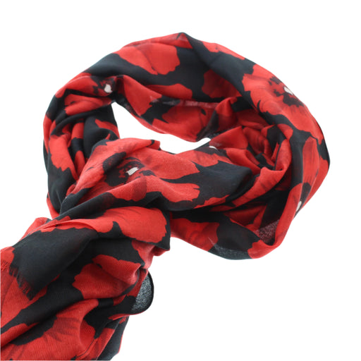 Red poppy print scarf wrapped in a circular shape.  - Image