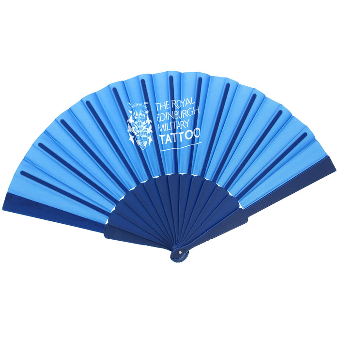 A folding hand fan in shades of blue, featuring the white printed logo and text 'THE ROYAL EDINBURGH MILITARY TATTOO' on the upper fan ribs, set against a plain white background. - Image