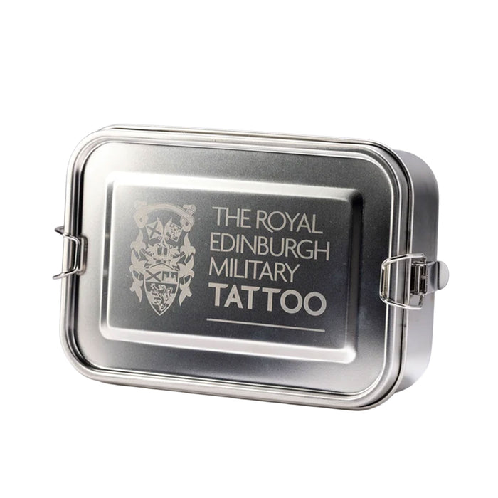 A rectangular metal tin with a hinged lid, featuring the text 'THE ROYAL EDINBURGH MILITARY TATTOO' and a crest printed on the lid, shown on a plain white background. - Image