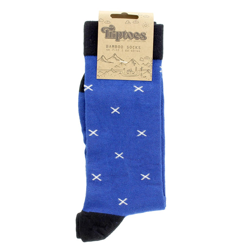 Blue sock with Scottish Saltire patterns and black toes, held by a cardboard holder on a white background - Image