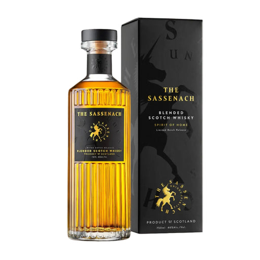 Bottle of whisky and black presentation box with gold text that reads 'The Sassenach'. - Image