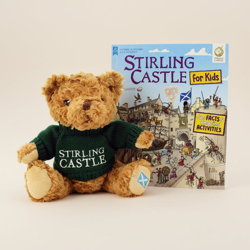 Teddy bear wearing a 'Stirling Castle' sweater with a book titled 'Stirling Castle for Kids' on a white background - Image