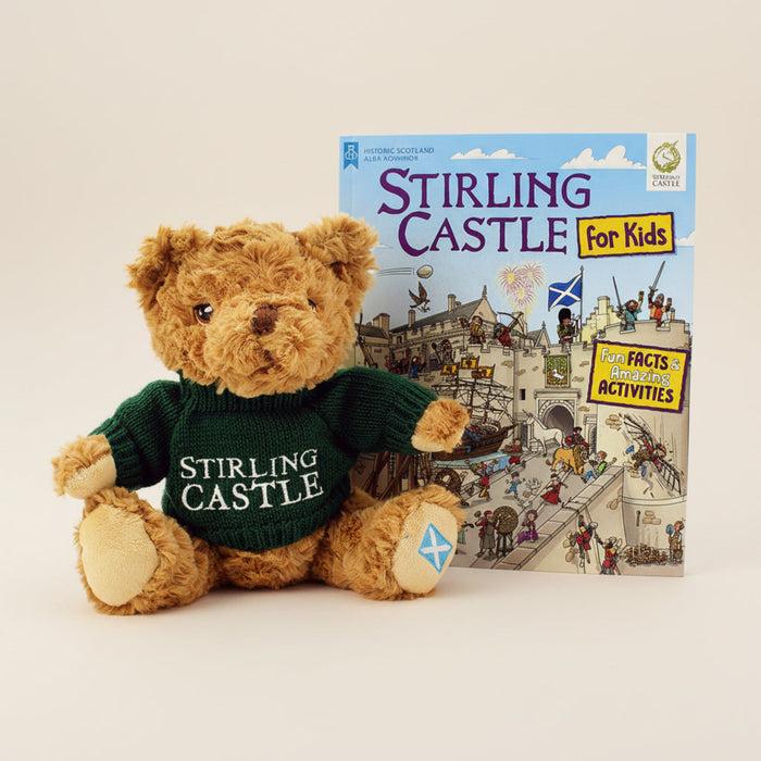 Teddy bear wearing a 'Stirling Castle' sweater with a book titled 'Stirling Castle for Kids' on a white background - Image