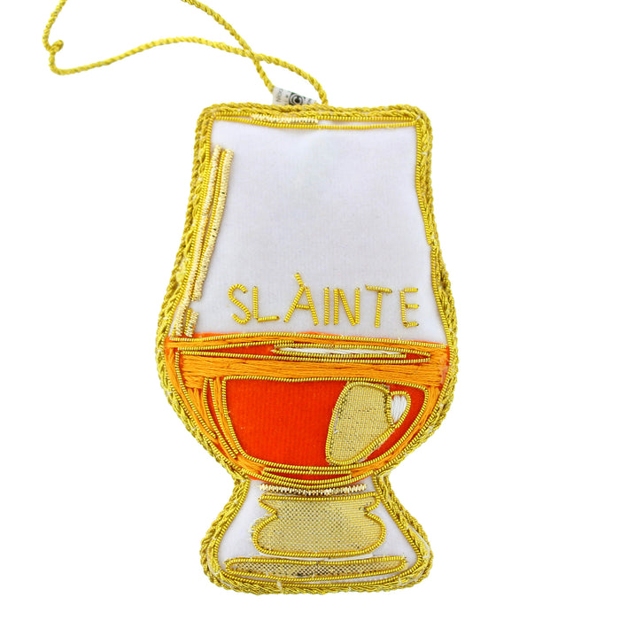 An embroidered Christmas hanging decoration shaped like a glass featuring the greeting 'SLÂINTE' in gold embroidery - Image