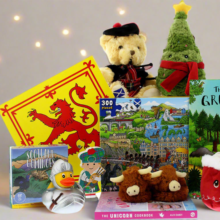 Collection of children's books and toys including a teddy bear, plush animals, and a Gruffalo book. - Image