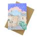 Greeting card with a snowy street scene illustration on a brown envelope. - Image