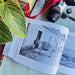 Book page featuring a donkey against a green backdrop - Image