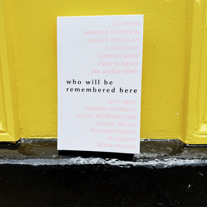who will be remembered here book on a black and yellow door step.  - Image