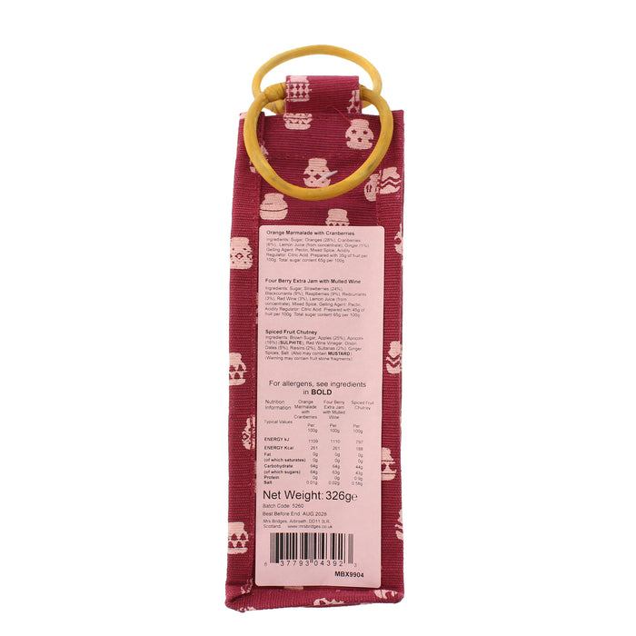 A bag of berry jam with a yellow plastic ring handle, featuring a red patterned fabric exterior and a white nutrition label on the back. - Image