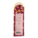 A bag of berry jam with a yellow plastic ring handle, featuring a red patterned fabric exterior and a white nutrition label on the back. - Image
