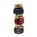 Three stacked glass jars of Mrs. Bridges Preserves on a white background, containing Christmas Preserve, Christmas Marmalade, and Christmas Chutney. - Image