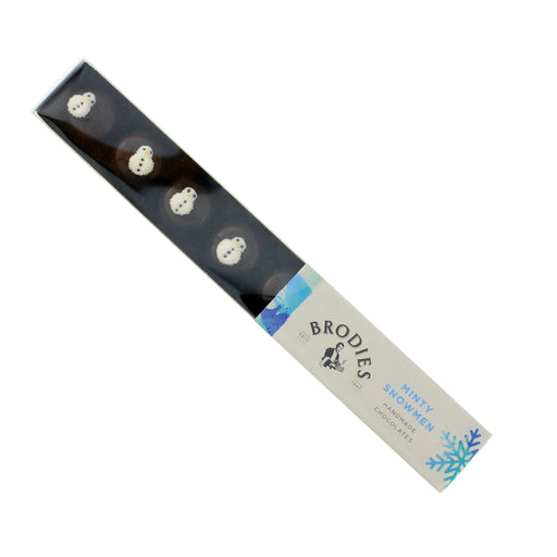 A package of Brodies Minty Snowmen chocolates, featuring white chocolate snowmen inside a long, narrow black box with a white and blue paper label. - Image
