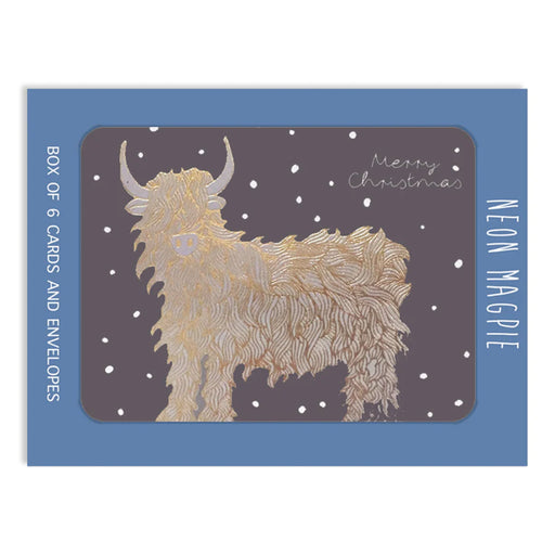 Box of 6 Christmas cards with a Highland Coo illustration on a blue background - Image