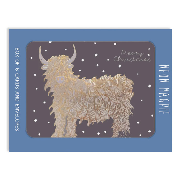 Box of 6 Christmas cards with a Highland Coo illustration on a blue background - Image