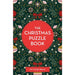 Front cover of 'The Christmas Puzzle Book' by Dr Gareth Moore, featuring a dark green Christmas tree pattern with red bows, white flowers, and ornaments surrounding a large red circle with white title text. - Image